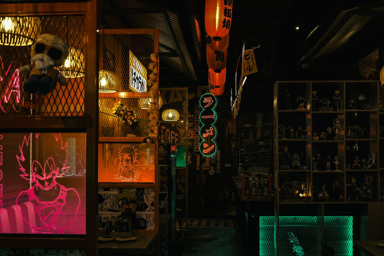 About Dark, moody Tokyo diner with neon signs and anime decor, capturing cyberpunk culture.